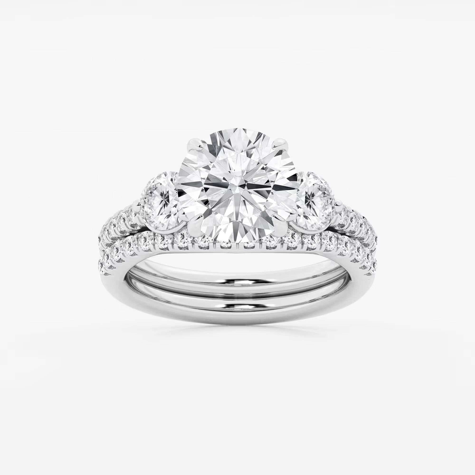 Three Stone Pavé Engagement Ring in White Gold with Round Brilliant Center Stone