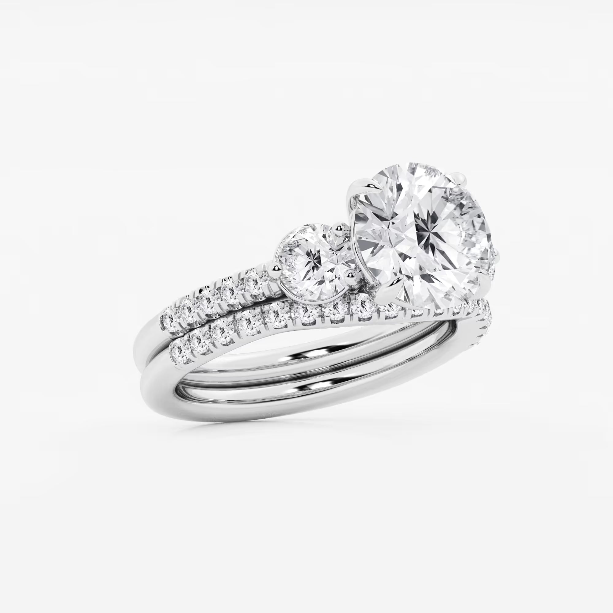 Three Stone Pavé Engagement Ring in White Gold with Round Brilliant Center Stone