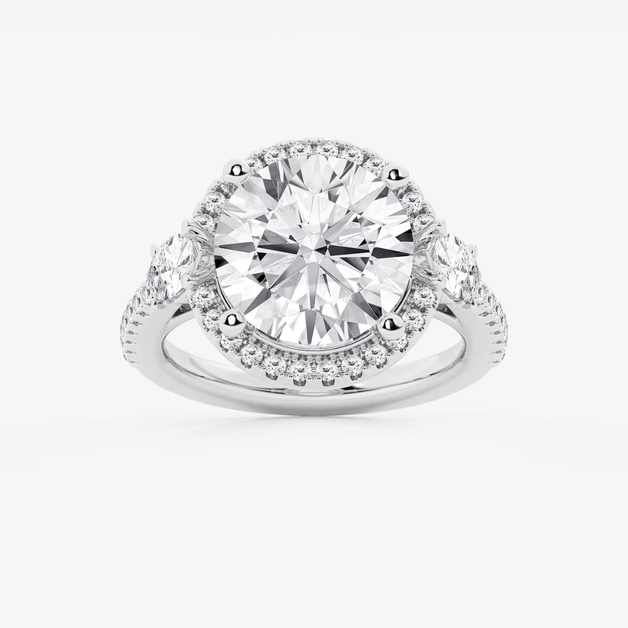 Three Stone Halo Engagement Ring in White Gold with Round Brilliant Center Stone