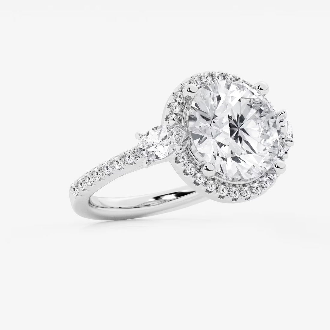 Three Stone Halo Engagement Ring in White Gold with Round Brilliant Center Stone