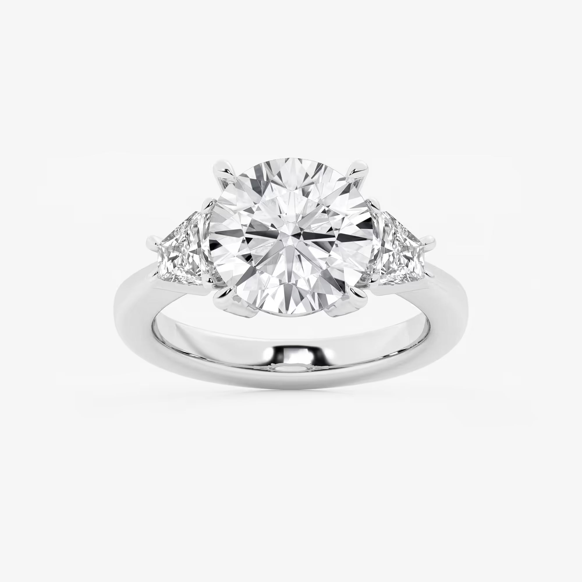 Three Stone Trillion Cut Engagement Ring in White Gold with Round Brilliant Center Stone