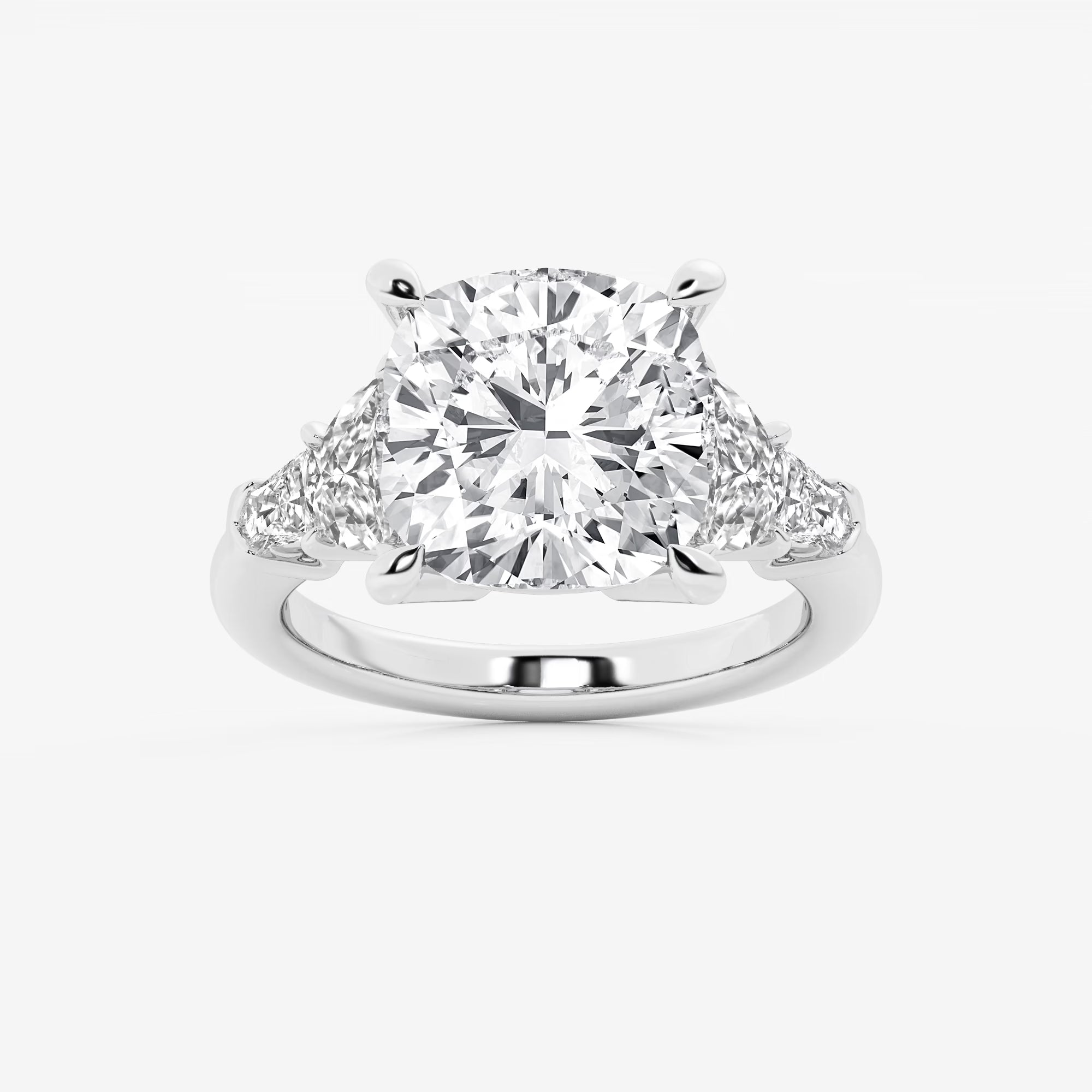 Three Stone Trillion Cut Engagement Ring in White Gold with Cushion Cut Center Stone