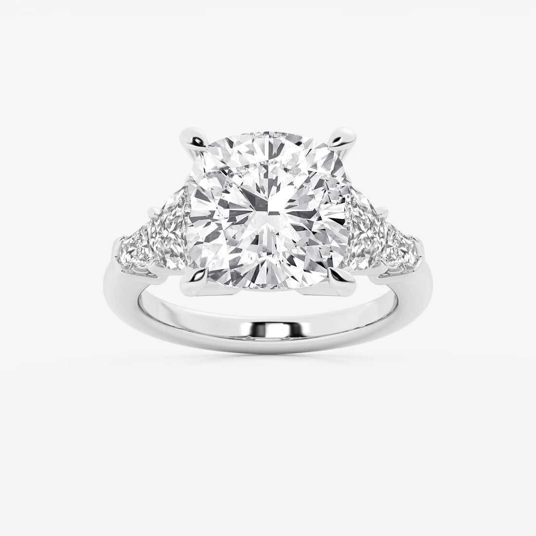 Three Stone Trillion Cut Engagement Ring in White Gold with Cushion Cut Center Stone