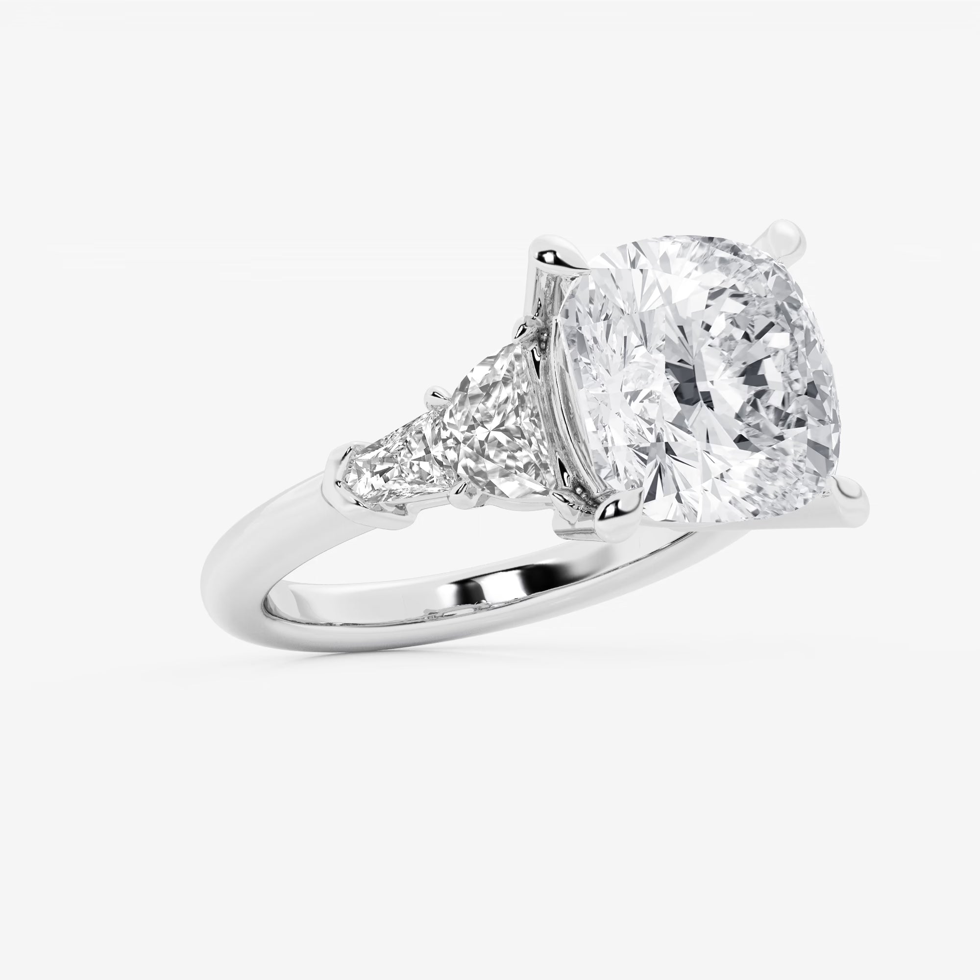 Three Stone Trillion Cut Engagement Ring in White Gold with Cushion Cut Center Stone