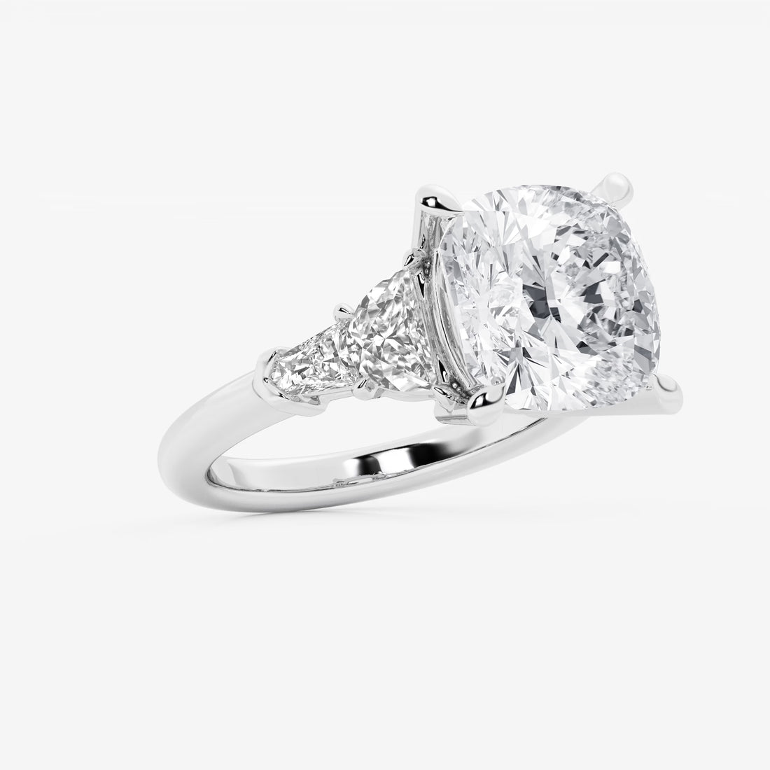 Three Stone Trillion Cut Engagement Ring in White Gold with Cushion Cut Center Stone