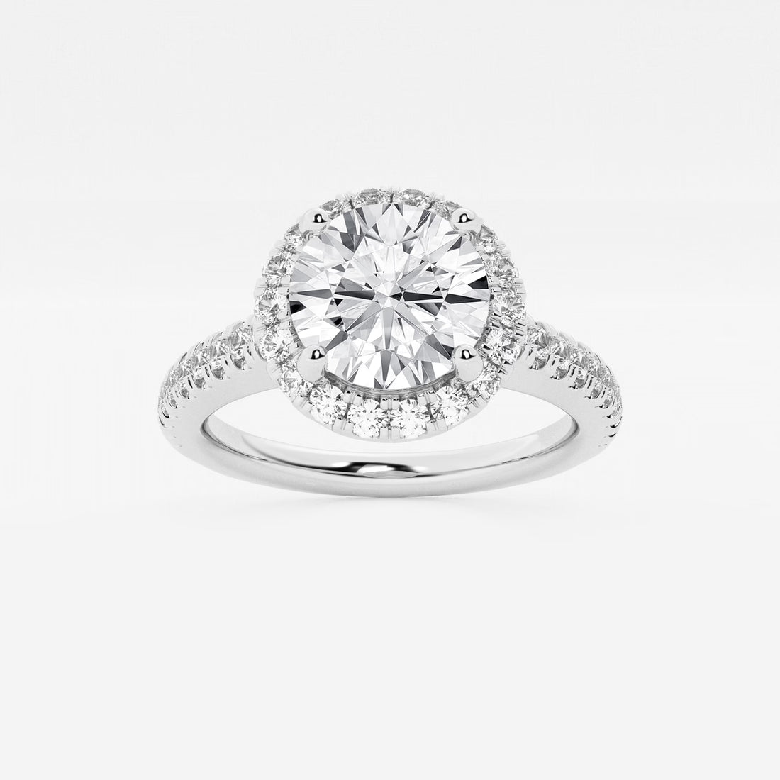 Halo Engagement Ring in White Gold with Round Brilliant Center Stone and Pavé Shank