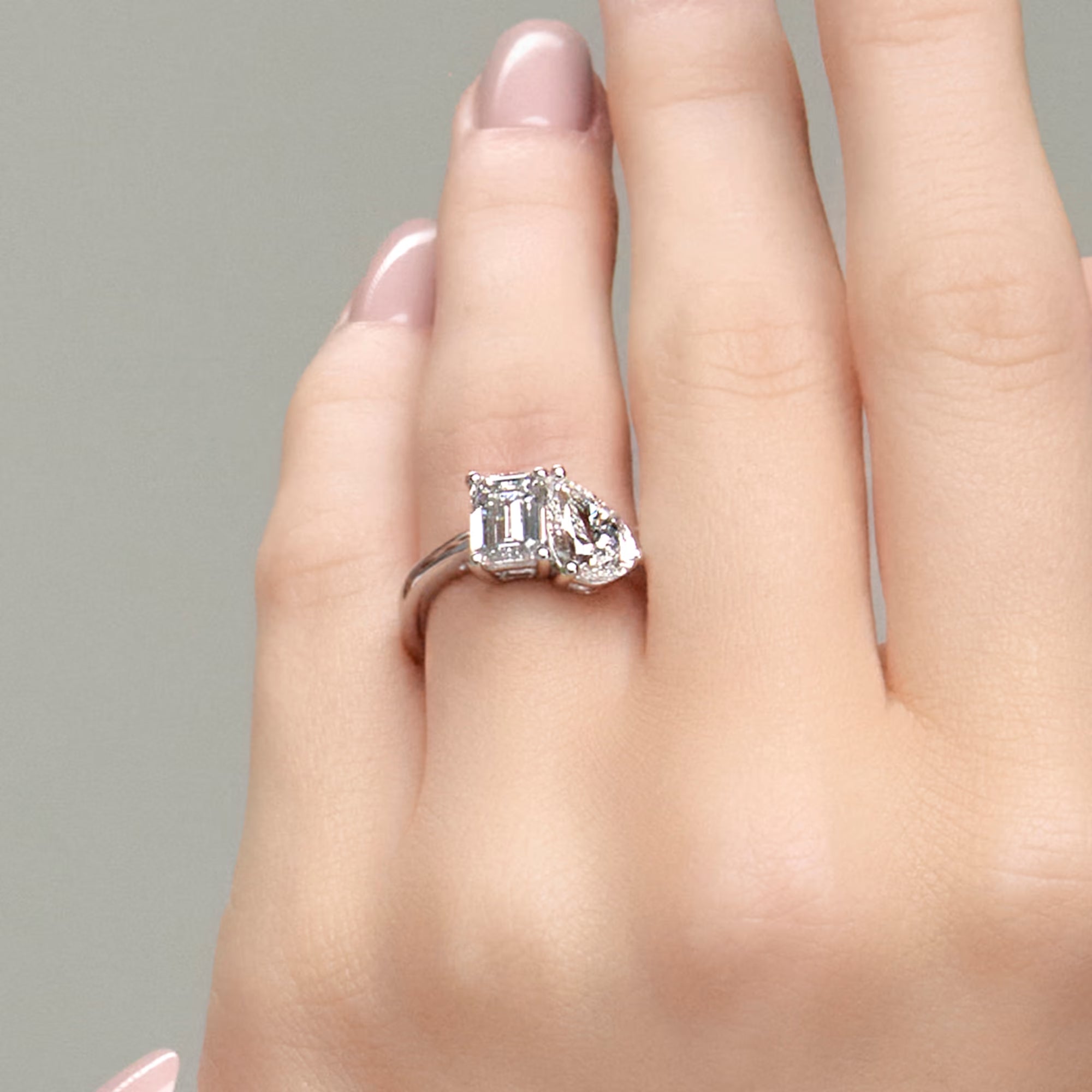 Toi et Moi Engagement Ring in White Gold with Emerald and Pear Cut Diamonds